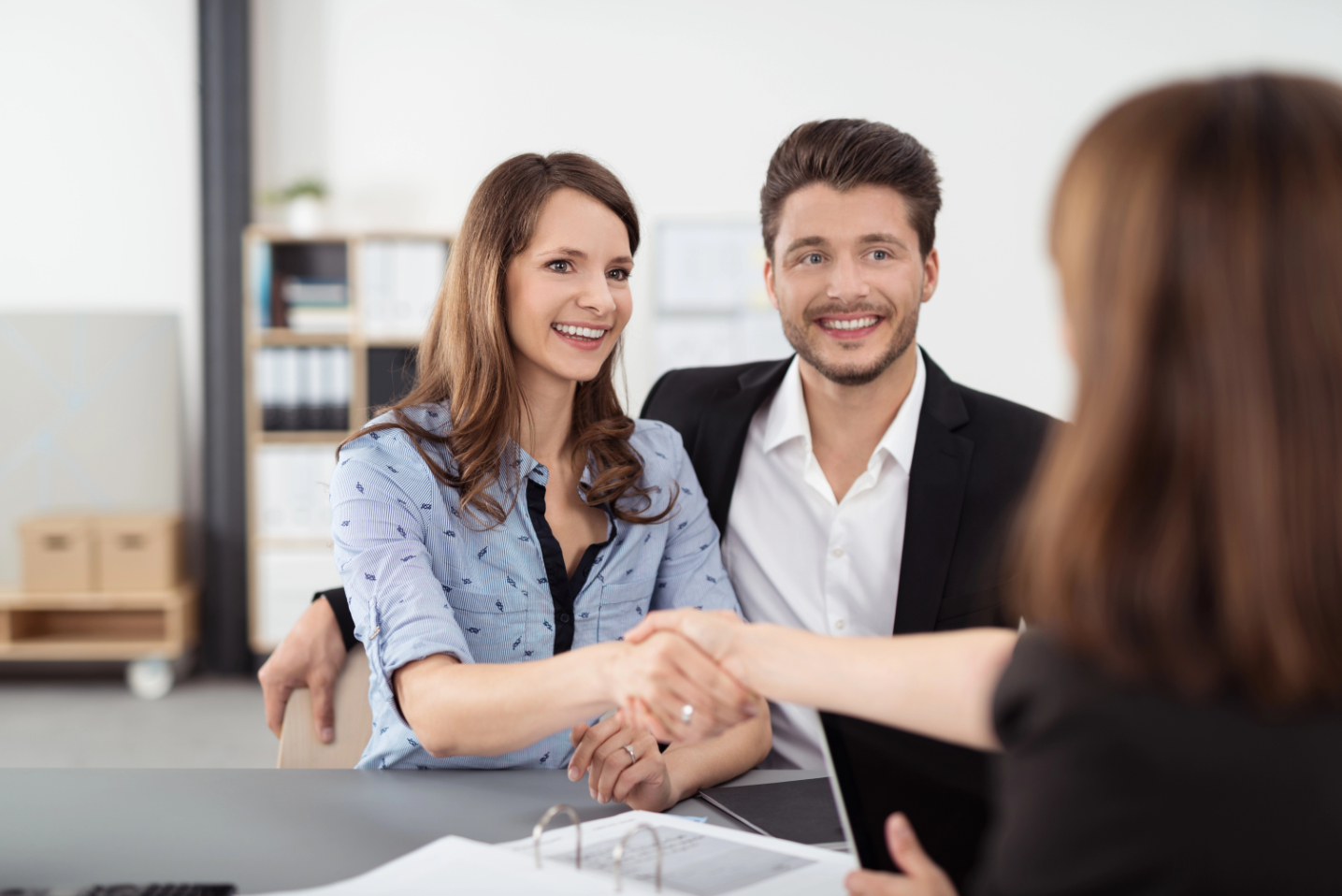 Couple and Realtor Handshake